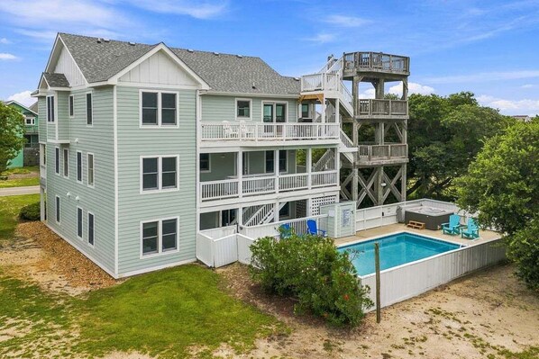 A two-story house with a pool and a deck. - A Shore Pleasure | 1,584 ft to the beach | Private Pool and Hot Tub (Corolla)