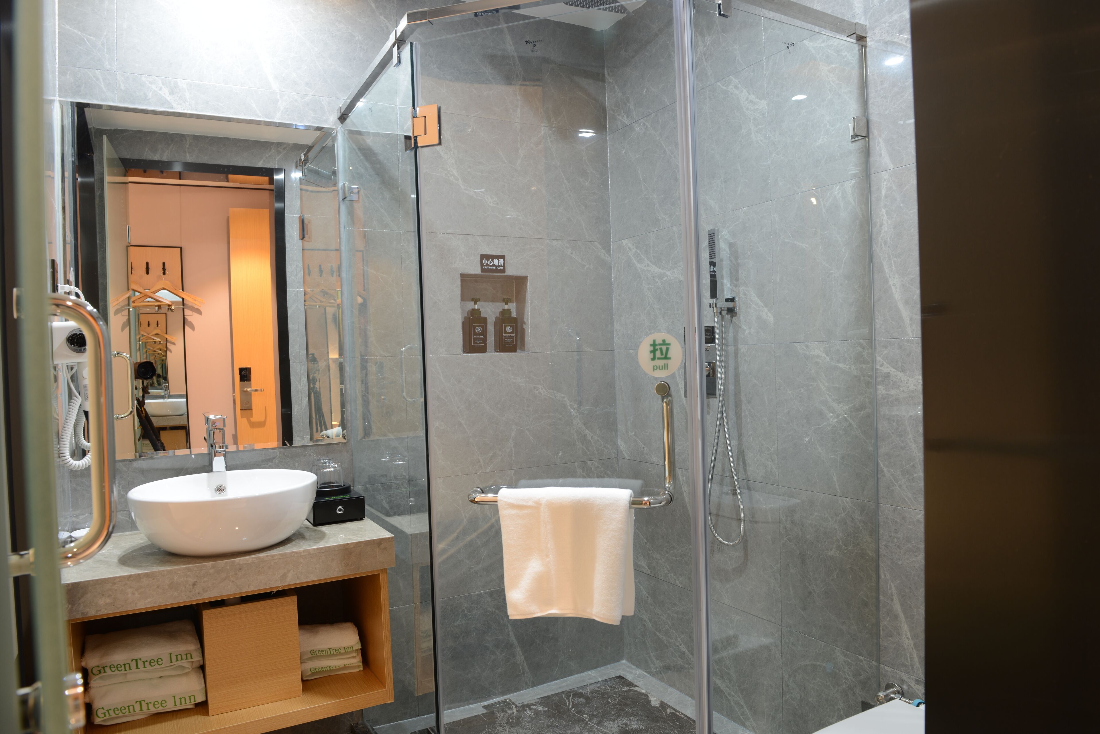 Shower, hair dryer, slippers, towels