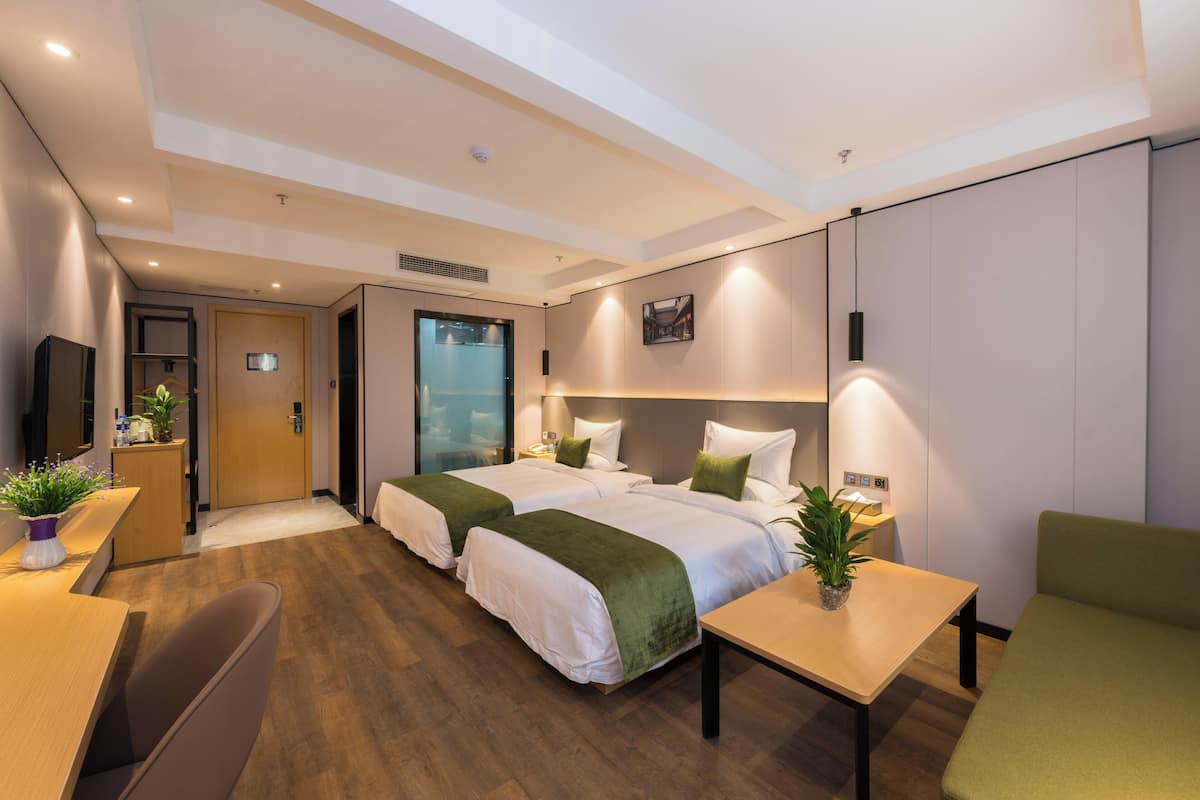 Family Triple Room, Housekeeping, City View | Desk, laptop workspace, blackout curtains, iron/ironing board