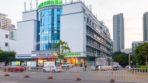 A modern hotel with a prominent glass facade and signage indicating it is a 'Smart Hotel'. - GreenTree Inn Fuzhou Sanfang Qixiang  (Fuzhou)