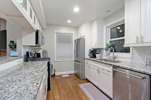 Fridge, microwave, stovetop, dishwasher - Stylish 3bedr •Family Retreat • Firepit • EV • 10 min to the Metro • Fenced Yard (Arlington)