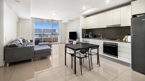 A modern apartment with a living room, dining area, and kitchen. - 2BR APT near Train Station/4ppl/Couple/Business (Canterbury)