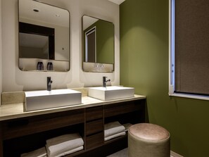 A bathroom with two sinks, mirrors, and a window. - KOKO HOTEL Sendai Station Central (Sendai)