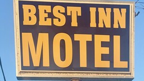 A signboard with the text 'BEST INN MOTEL' in large, bold letters.