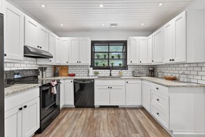 Fridge, microwave, oven, stovetop - Rio River Lodge- Riverfront home in McCall with sauna, hot tub, game room (McCall)