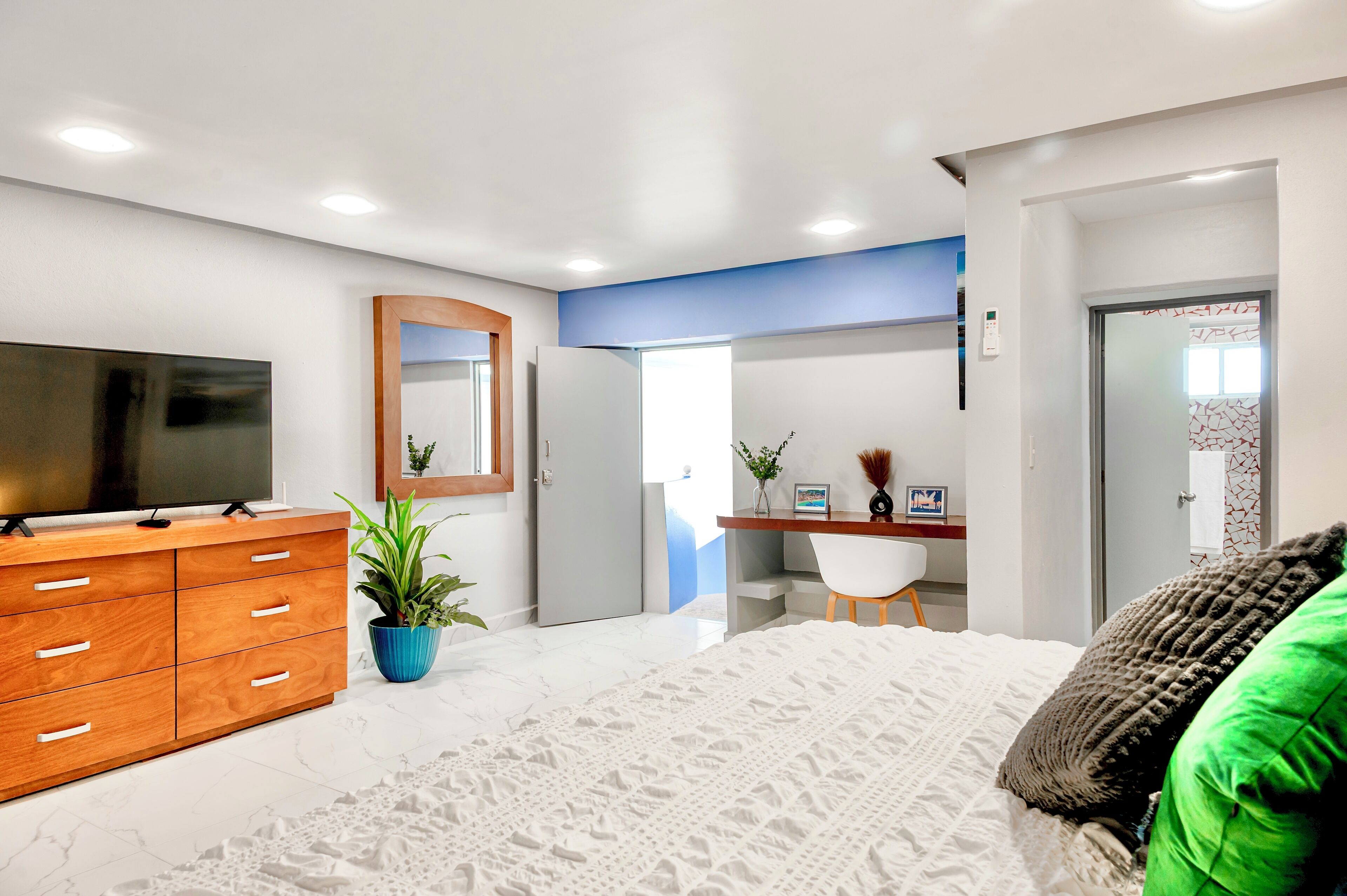 Deluxe Condo, Balcony, Partial Ocean View | In-room safe, iron/ironing board, free WiFi