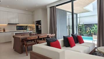 Standard Villa (4 Bedrooms) | Living area | 50-inch Smart TV with cable channels