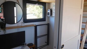 A compact bathroom with a mirror, sink, and window. - LA CHARMOTTE - Verbiesles (Verbiesles)