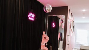 A room with a pink carpet, black curtains, a disco ball, and a mirror reflecting a pink light. - Just minutes from River walk and downtown San Antonio, (San Antonio)