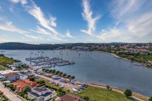 A marina with boats, a small town in the background, and houses along the waterfront. - Panoramic Sea view Apartment 2 with Pool, Pula, Croatia (Pula)