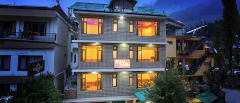 A multi-story hotel with a sign reading "The Veer Villa."