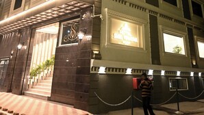 A hotel with a classic facade, multiple windows, and a well-lit entrance. - Hotel Shri Vinayak (Varanasi)