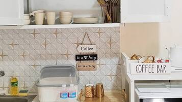 Fridge, microwave, stovetop, coffee/tea maker