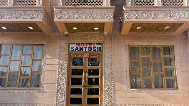 A building with a sign reading "HOTEL SANTOSH." - Hotel Santosh Heritage (Pushkar)