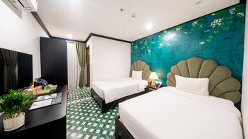 Hypo-allergenic bedding, free minibar items, in-room safe, desk