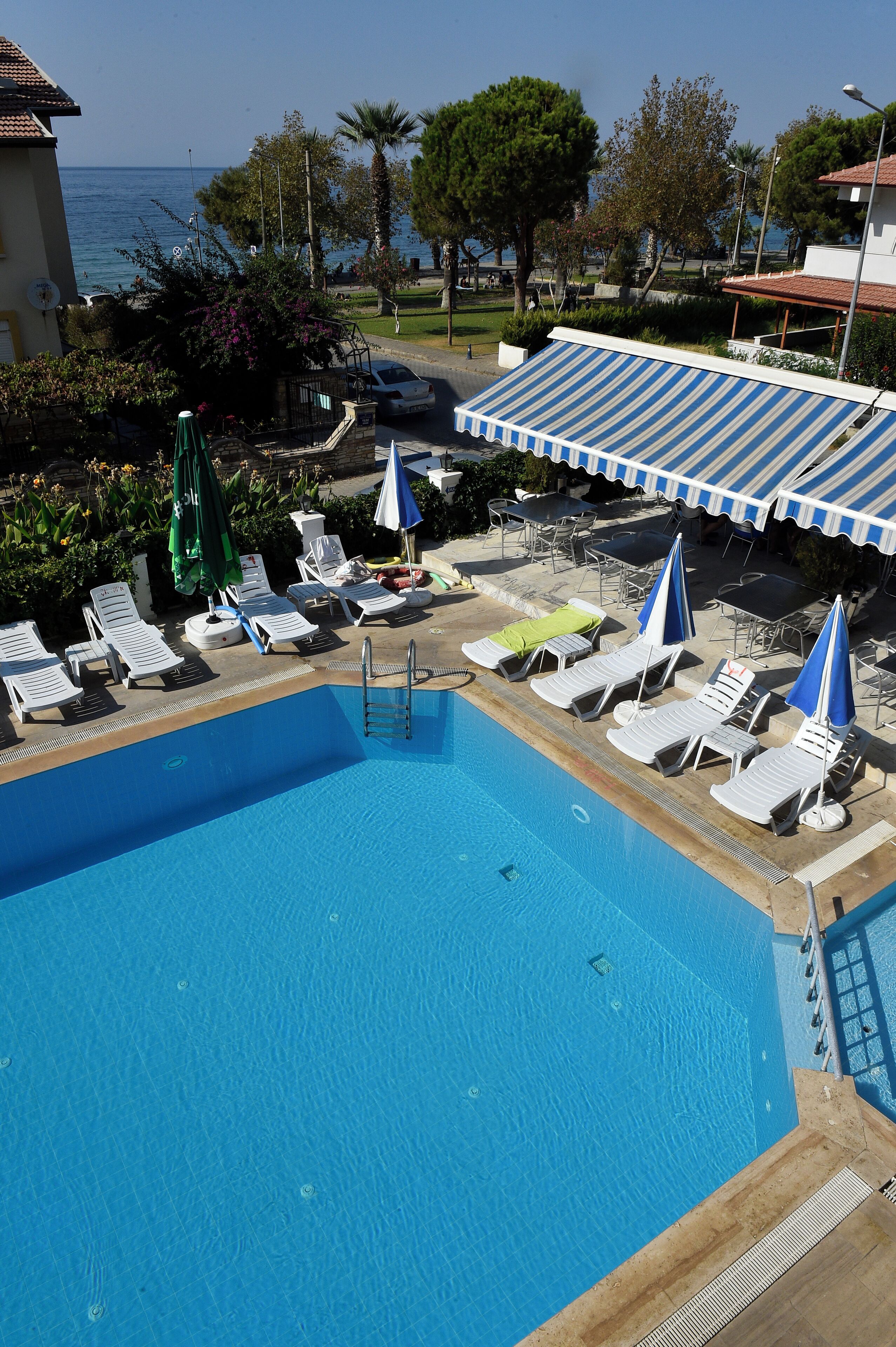 Seasonal outdoor pool, open 9:00 AM to 7:00 PM, pool umbrellas