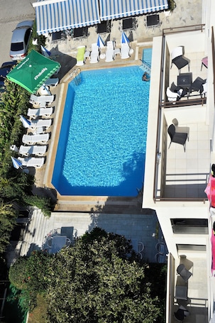 Seasonal outdoor pool, open 9:00 AM to 7:00 PM, pool umbrellas