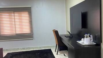 Deluxe Room, Balcony, City View | Desk, laptop workspace, blackout curtains, soundproofing