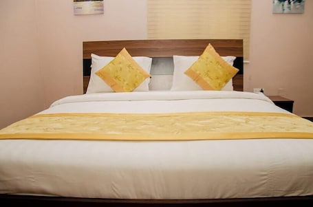 Deluxe Room, Balcony, City View | Desk, laptop workspace, blackout drapes, soundproofing