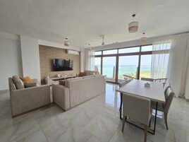 Executive Apartment, Multiple Beds | Living area | 55-inch Smart TV with digital channels