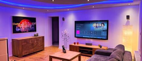 Smart TV, fireplace, books, stereo