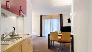 Fridge, microwave, stovetop, coffee/tea maker