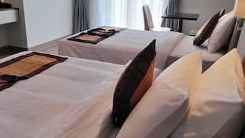 Family Room, Balcony, City View | Desk, laptop workspace, iron/ironing board, free WiFi