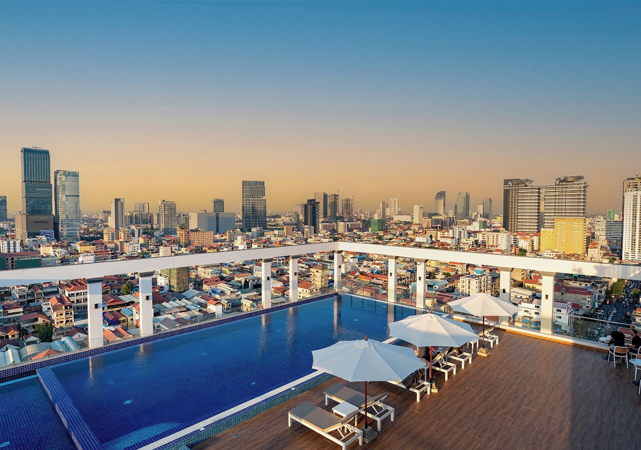 Outdoor pool, open 6:00 AM to 9:00 PM, pool umbrellas