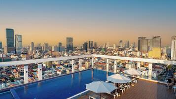 Outdoor pool, open 6:00 AM to 9:00 PM, pool umbrellas