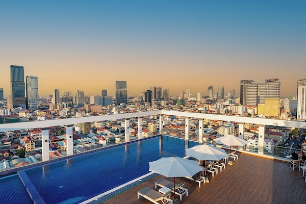 Outdoor pool, open 6:00 AM to 9:00 PM, pool umbrellas