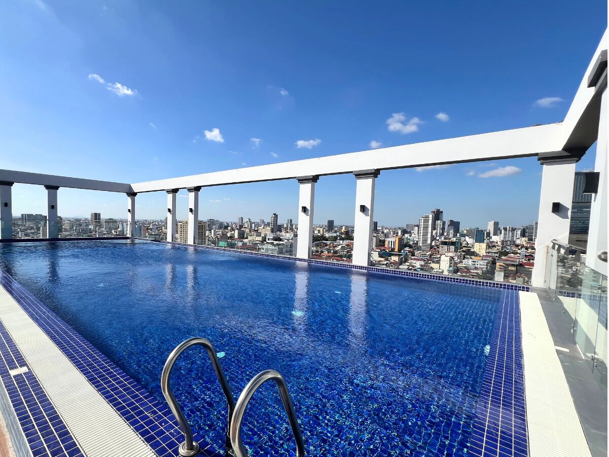 Outdoor pool, open 6:00 AM to 9:00 PM, pool umbrellas