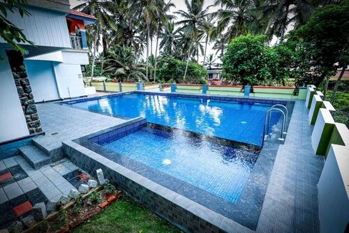 Ocean Queen Palace Poovar – Double Room with Tranquil Garden Views