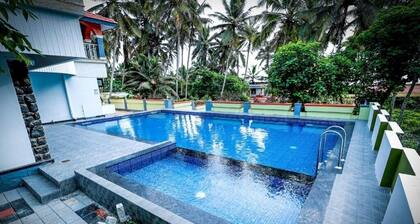 Ocean Queen Palace Poovar – Double Room with Tranquil Garden Views