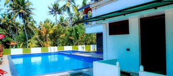 Ocean Queen Palace Poovar – Elegant Deluxe Queen Room