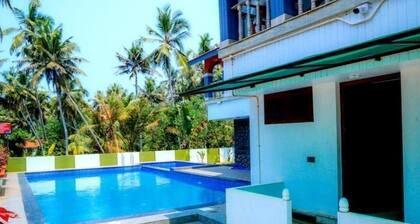 Ocean Queen Palace Poovar – Queen Room with Peaceful Garden Views