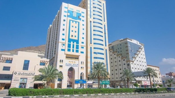 A hotel with a prominent entrance, multiple floors, and a modern architectural design. - Asfour Hotel 01 (Makkah)