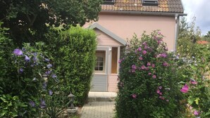 A pathway leading to a house with a tiled roof and a small porch. - Geiserich by Interhome (Blankenburg)