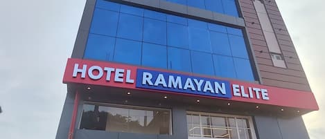 A modern building with a sign reading "HOTEL RAMAYAN ELITE".