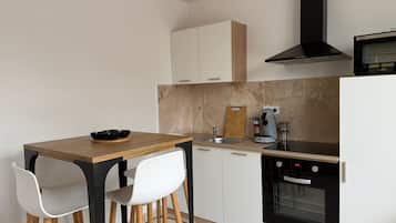 Oven, stovetop, coffee/tea maker, dining tables
