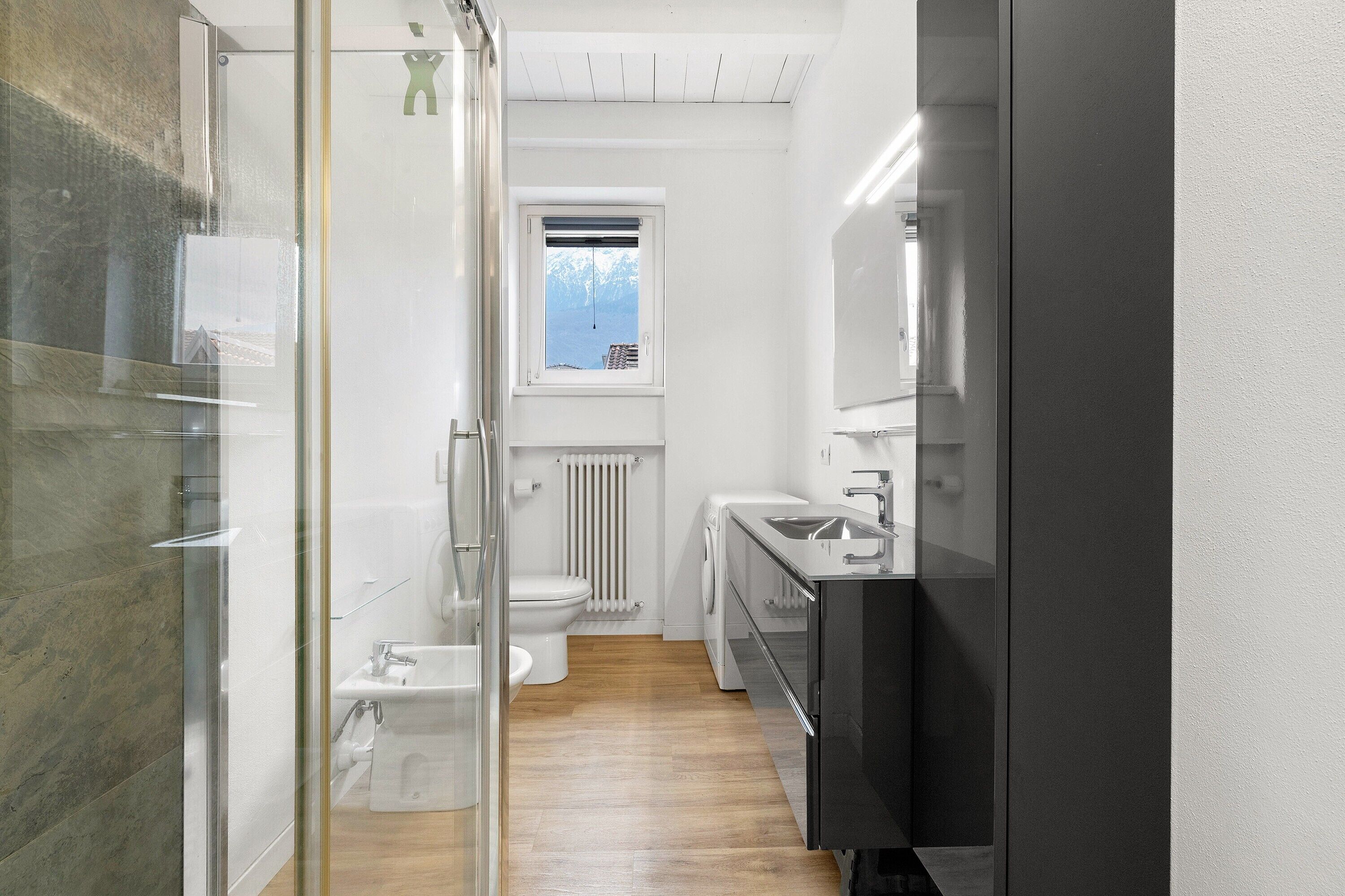 Shower, hair dryer, towels, toilet paper