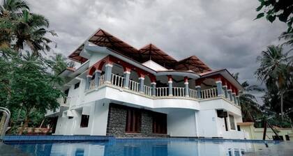 Ocean Queen Palace Poovar – Deluxe Double Room with Stunning Sea View