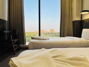 Deluxe Double or Twin Room | Egyptian cotton sheets, premium bedding, memory foam beds, desk - Ibiza Hotel (Ahmedabad)