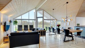 A spacious kitchen with a dining area, large windows, and a modern design. - VillaVilla 264 - Kegnæs, Sydjylland (Sydals)