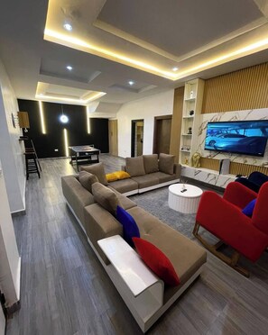 Junior Apartment, Balcony, City View | Living area - Declans Apartment (Abuja)