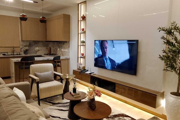 Luxury Apartment, 2 Bedrooms, Non Smoking, Microwave | Living area | 45-inch LED TV with cable channels, Netflix, first-run movies