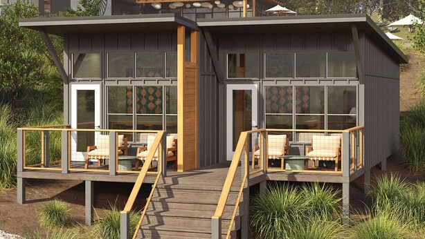 A modern house with a wooden deck, two outdoor seating areas, and large windows. - Outbound Yosemite (Oakhurst)