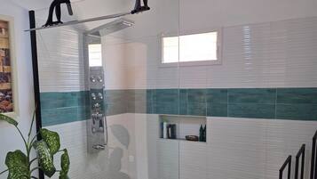 Shower, hair dryer, towels, soap