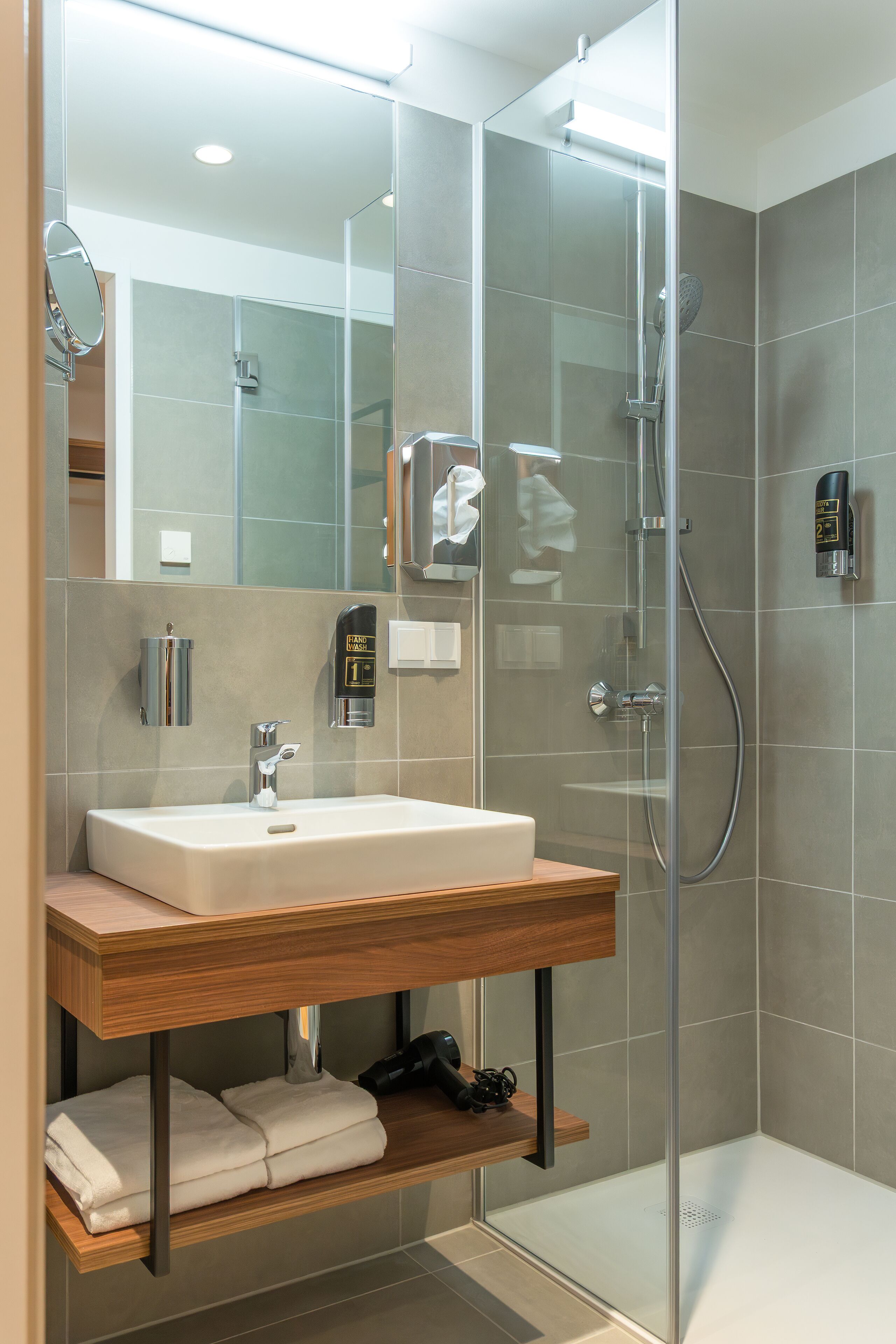 Shower, hair dryer, slippers, towels