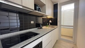 Family Apartment, Balcony, City View | Private kitchen - Oceana Suites Departamental (Santiago)