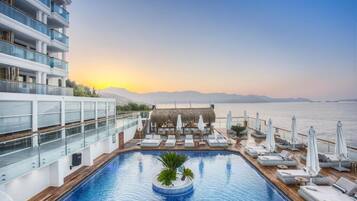 Seasonal outdoor pool, free pool cabanas, pool umbrellas